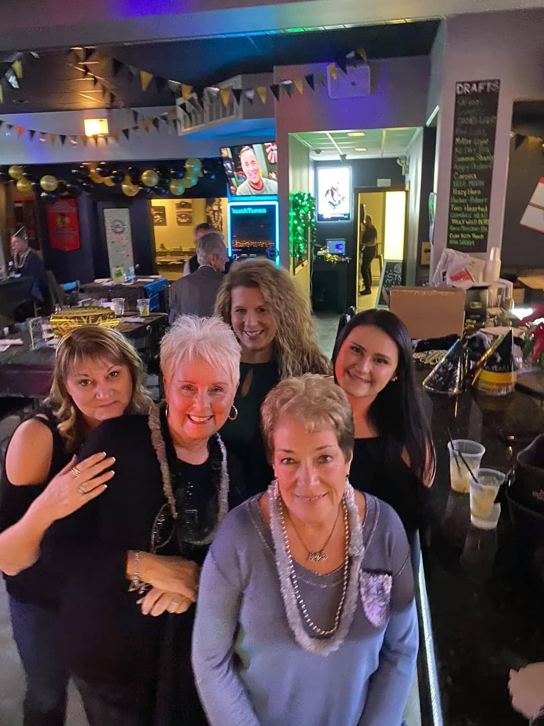 Women with family enjoying time together at Rooftop Johnnys in Palos Heights, Illinois