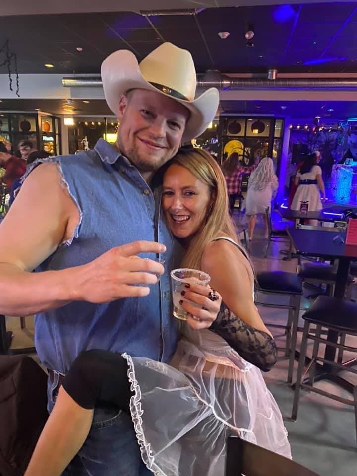 Smiling couple enjoying rooftop dining at Rooftop Johnnys Palos Heights IL